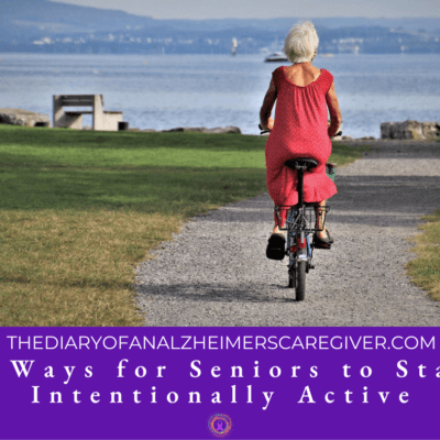 elderly woman riding her bike down a gravel road.